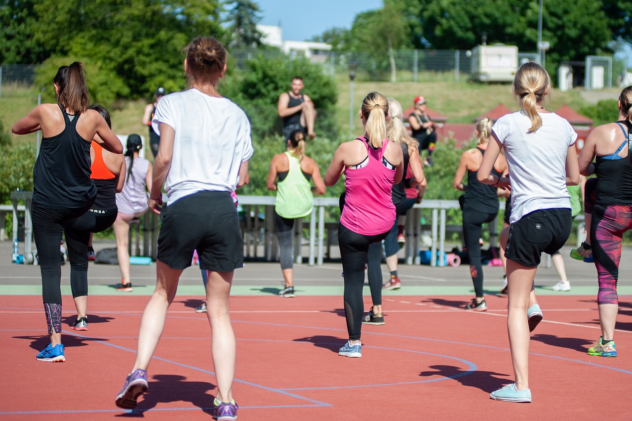 A group of people regularly exercising outdoors. image by AndrzejRembowski