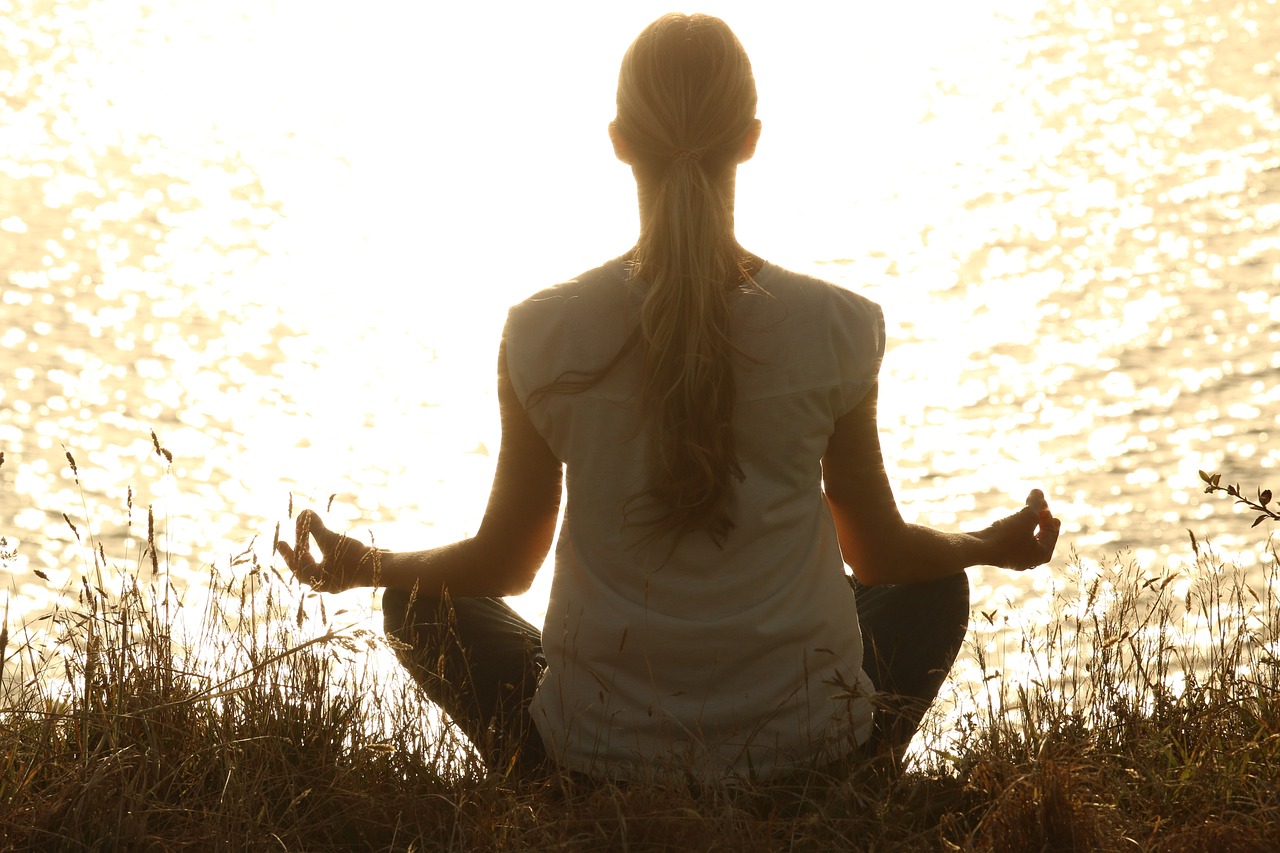 Woman meditating in the sun