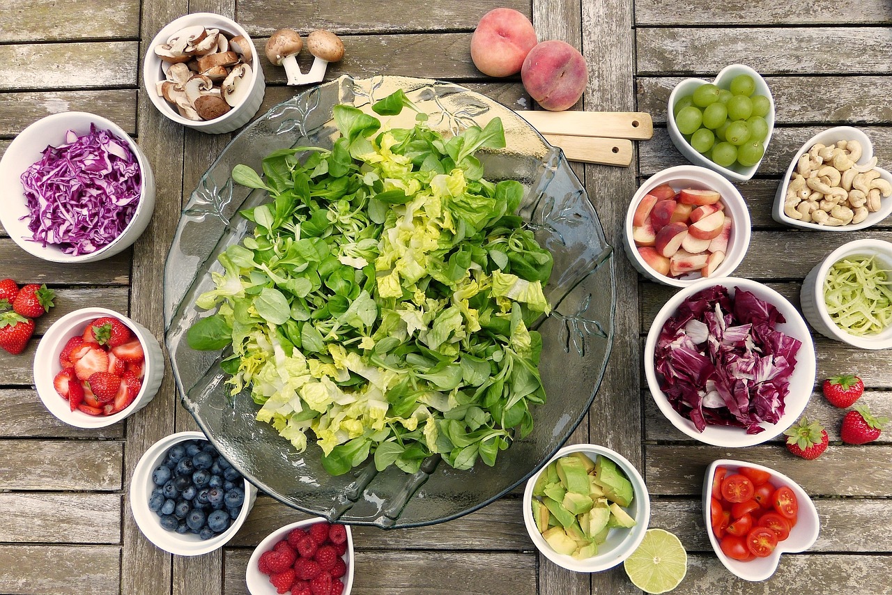 Different Fruits and Vegetables Set Out For a Salad